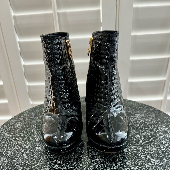 Tory Burch black patent leather ankle boots with logo, and zip closure at side. - Picture 1 of 9